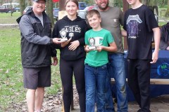 Man presents family with trophy