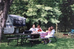 Campers at a picnic table