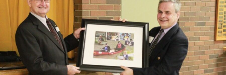 Andy Bruziewicz (right), outgoing Chair for the SCRCA is presented with a gift by Norm Giffen, outgoing Vice Chair