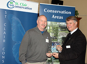 Doug Rogers receives his award from Steve Arnold, SCRCA Chair