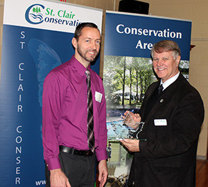 Ken VanMinnen, Principal Strathroy Community Christian School receives their award from Steve Arnold, SCRCA Chair