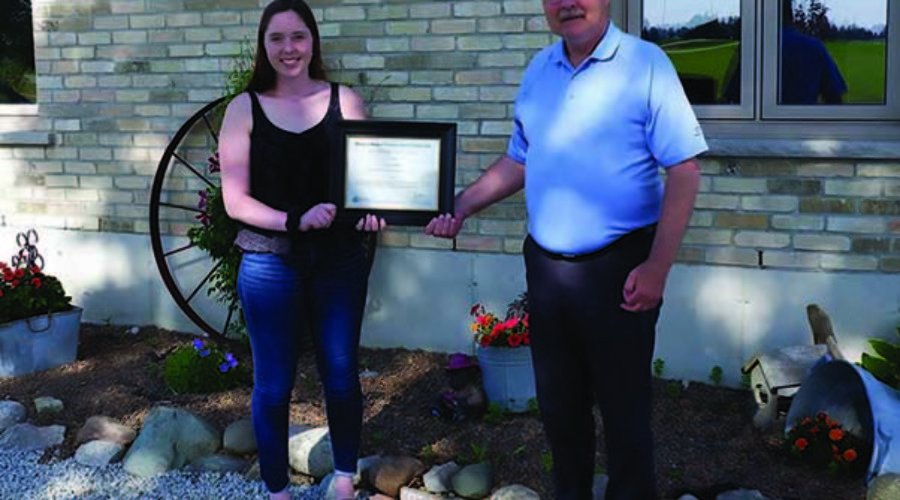 SCRCA Scholarship Recipient receives her award from SCRCA Chair, Joe Faas.