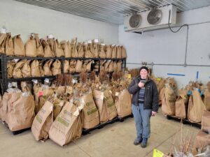 St. Clair Staff stand among tree seedlings